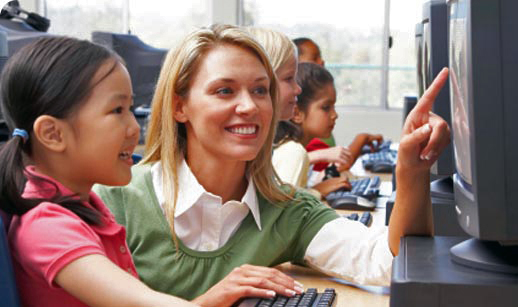 Teacher with student teaching typing program